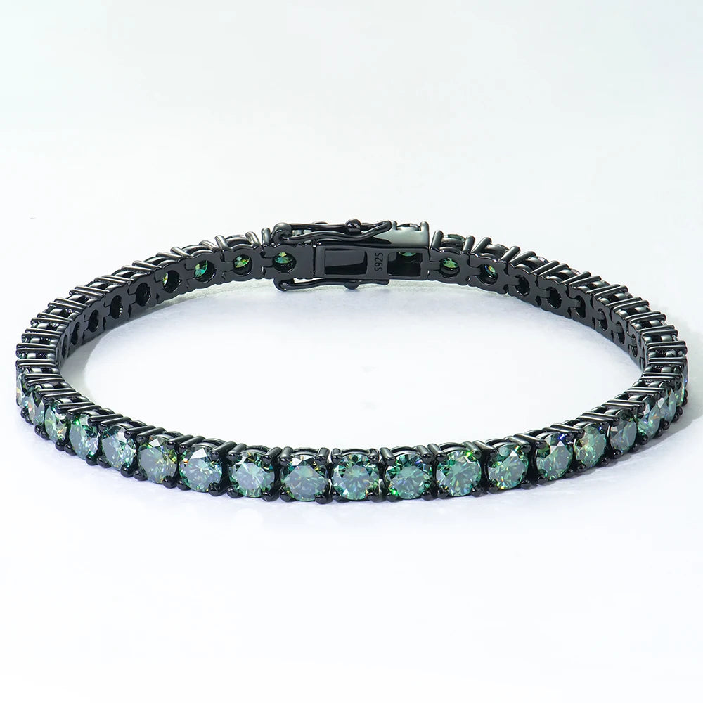 Black metal bracelet with green gemstones on a white background
