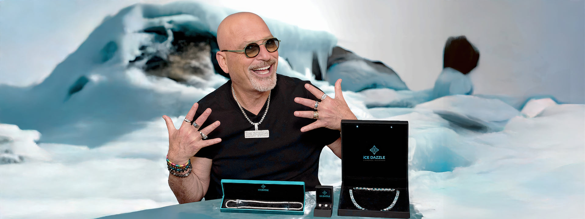 Howie Mandel in sunglasses with Ice Dazzle brand jewelry products on a snowy background