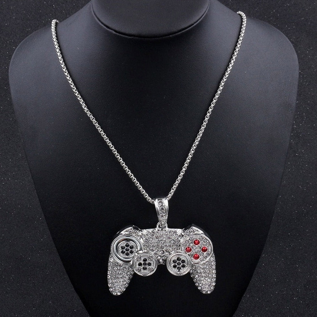  Close-up of the ice dazzle gaming controller pendant on a dark background